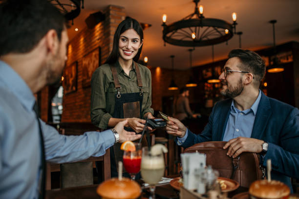 istock Business associates settling the bill 2100941936