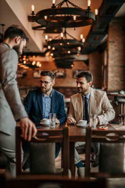istock Business professionals gather in a relaxed setting 2100942449