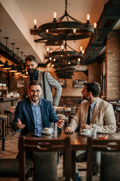 istock Professional men shaking hands and exchanging pleasantries 2100942450