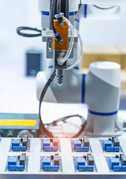 istock automatic robot for print circuit board (PCB)assembly machine during soldering or welding part 2100942459
