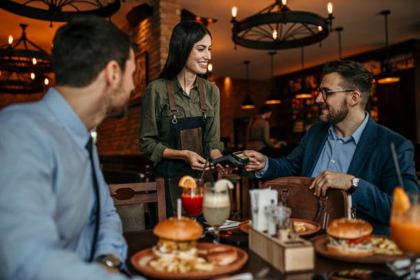 istock Business associates settling the bill 2100942469