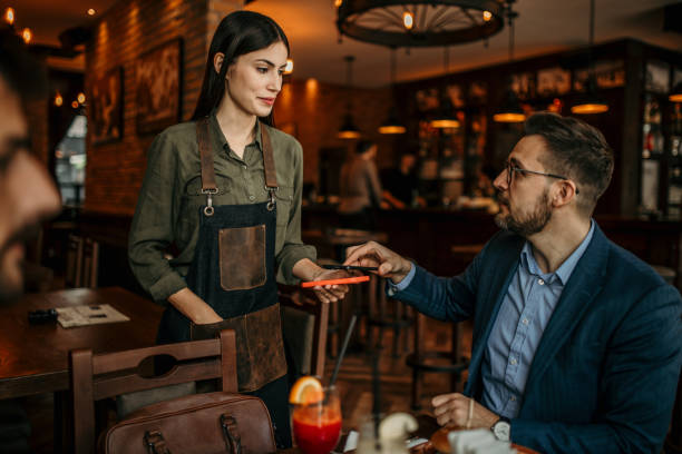 istock Businessman paying job lunch 2100943541
