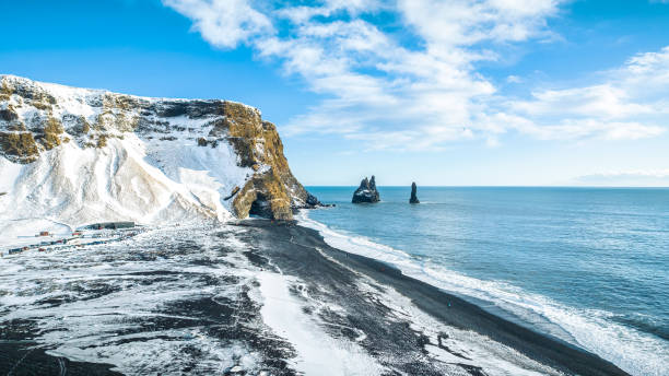 istock Reynisfjara Beach (Reynisdrangar) o black sand beach in Iceland by Drone 2100955950