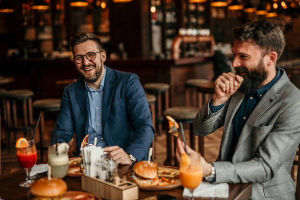 istock Business colleagues bonding over burgers 2100957248
