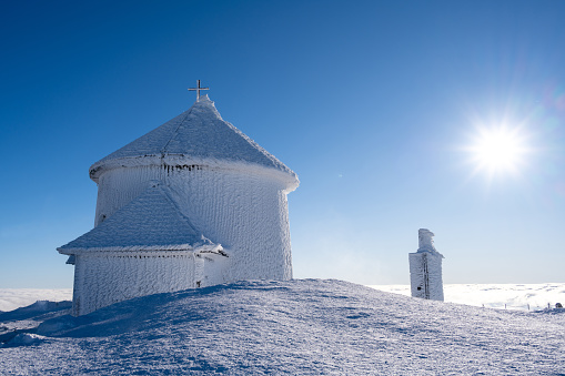 chapel on peak of Sniezka mountain during frozen sunny day