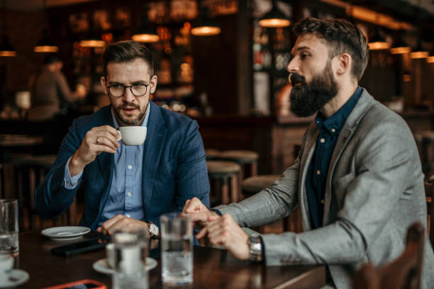istock Businessmen in bar 2100983947
