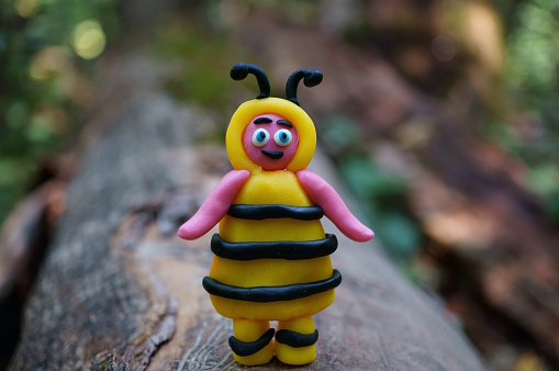 Photo of a toy bee made of plasticine.