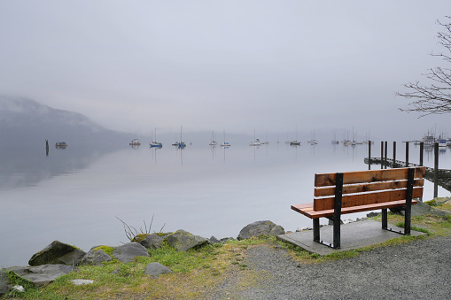 A peaceful scene with Changjiang River and mountains in the background on a foggy day