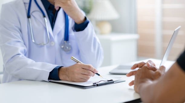 istock Doctor and patient are discussing consultation about symptom problem. Doctor explained the patient's condition and how to care for the patient in detail. 2101007344