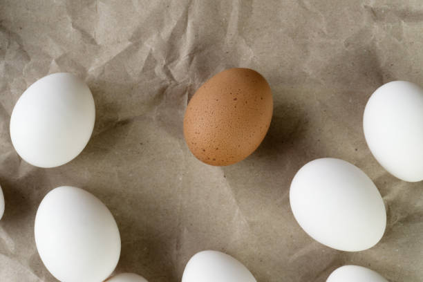 istock White and brown eggs on the table. View from above 2101011225