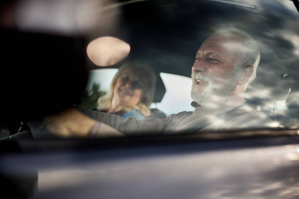 istock Happy senior couple going on a trip by car. 2101020522