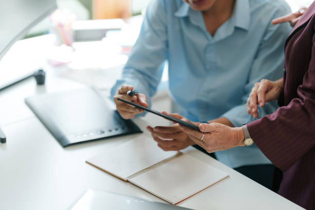 istock Team of creative graphic designers work together in a workplace. 2101029167