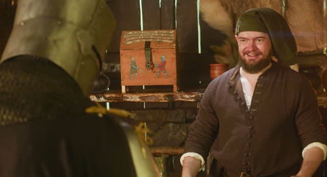 Merchant deals with adventurer in tavern