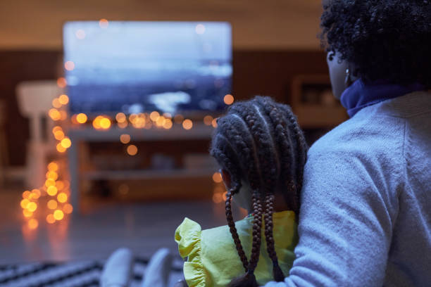 istock Mother and daughter watching Tv together 2101081068