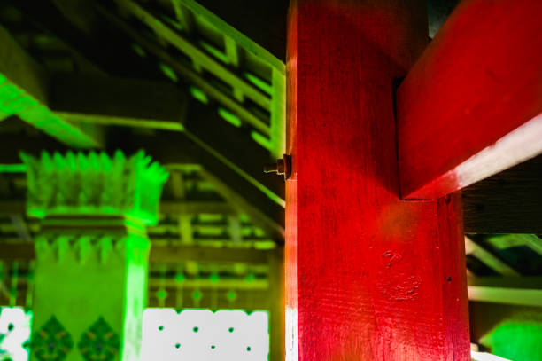 Red column and beam at a temple in Nakhon Sawan Province, Thailand.