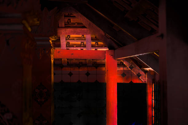 Red column and beam at a temple in Nakhon Sawan Province, Thailand.