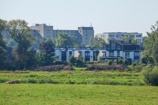 Modern residential building with meadow on the Leine, Neustadt am Rübenberge, Lower Saxony, Germany