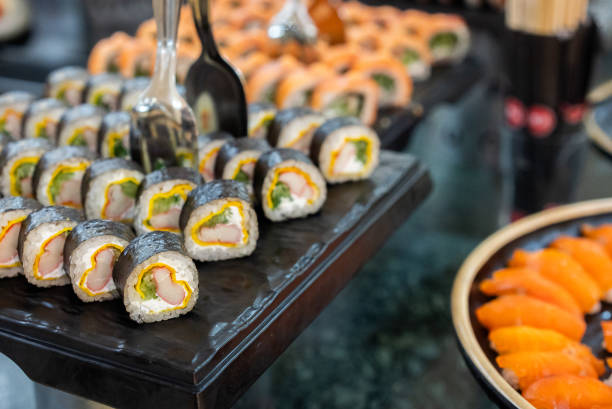 Variety of sushi on the trays in the buffet