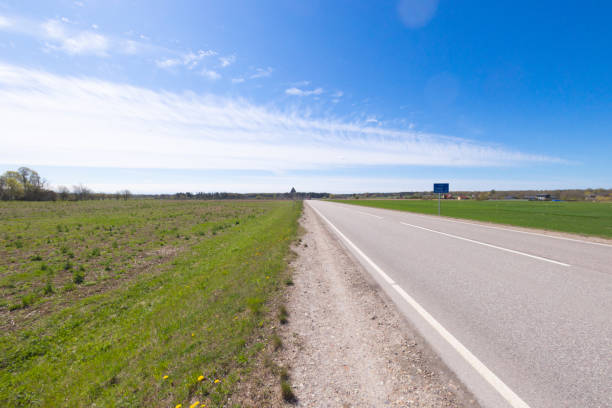 istock A beautiful springtime scenery with alphalt road in Latvia. 2101115240