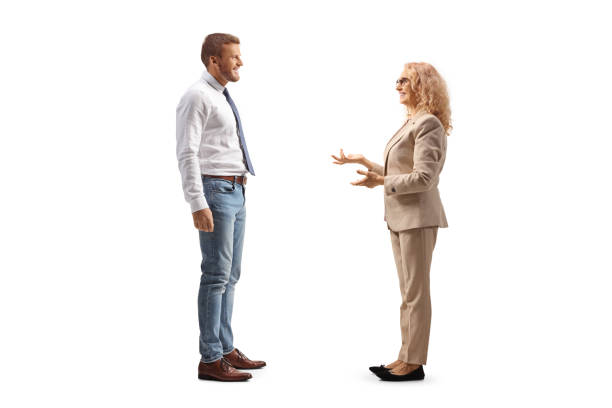 istock Professional man and woman standing and discussing 2101120014