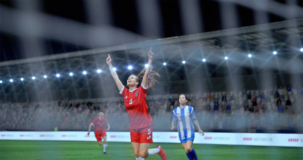 istock Football players celebrating on field 2101133655