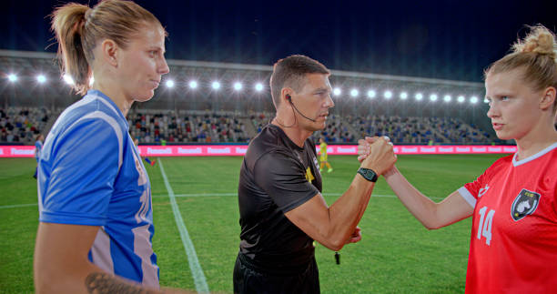istock Referee with team captions greeting each other 2101134226