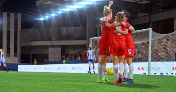 istock Football team celebrating goal 2101134229