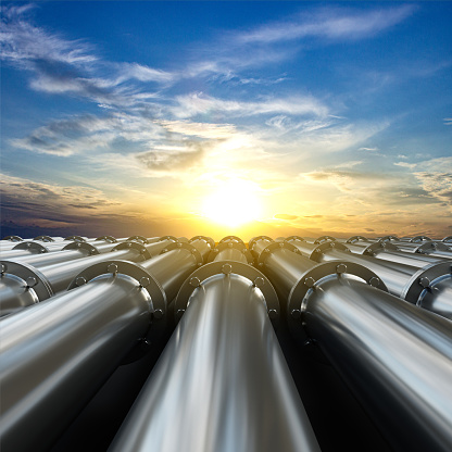 Tubes running in the direction of the setting sun. Fuel industry transportation line connection. 3d-rendering