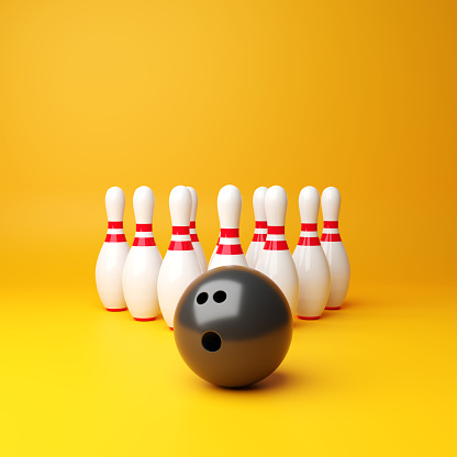 Bowling ball and pins on yellow background. 3d-rendering