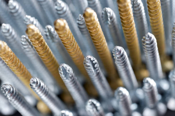 Close up of a large group of countersunk lag bolts for joining wood parts