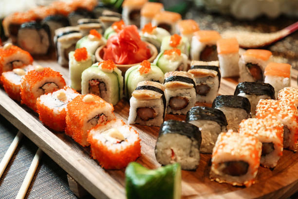 istock Wooden Tray With Assorted Sushi Rolls 2101258853