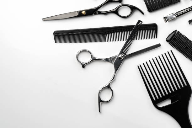 istock Black hairdressing tools and various hairbrushes on white background 2101269961