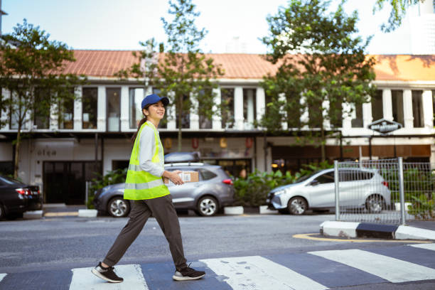istock Delivery:  Asian Female Worker Finding Location 2101272102