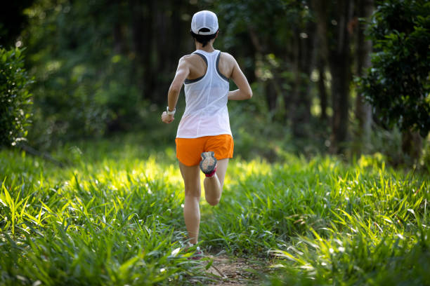 istock Trail runner running in summer forest trail 2101279096