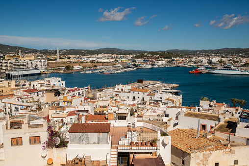 View of the old town, with the typical red roofs and white houses and the harbor of Ibiza, Ibiza Island, Balearic Islands, Spain