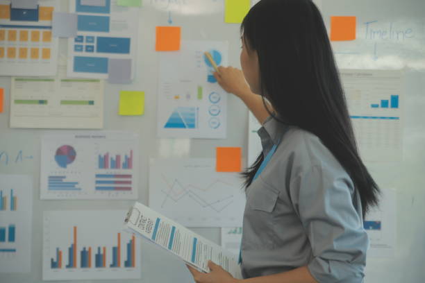 istock Business team collaboration discussing working analyzing with financial data and marketing growth report graph in team, presentation and brainstorming to strategy planning making profit of company. 2101292771