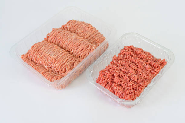 istock Ground beef and pork side by side. Difference in color between ground beef and pork. Store packaging. isolated on white table 2101317355