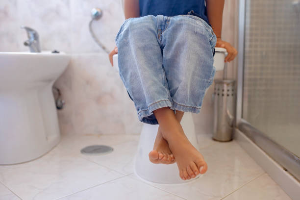 istock Cute child, boy, sitting on the toilet 2101339601
