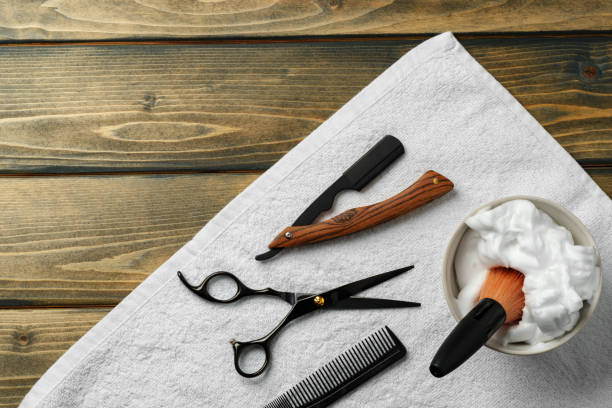 istock Hairdressing barber tools on wooden background close up 2101349376