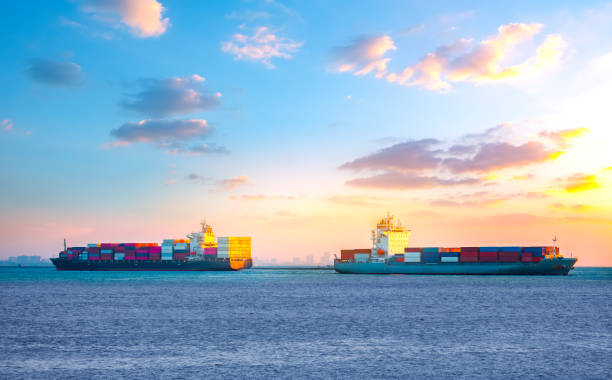 istock Two large container ships sail by international maritime transport. Import-export business, logistics, transportation industry concepts 2101368901