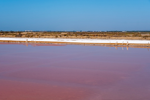 Piles of salt in the salt flats of Iptuci in Prado del Rey, Cadiz province, Andalusia, Spain. Settling ponds for salt production by evaporation.