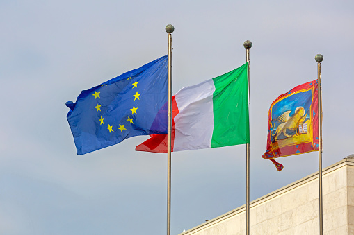 Venice, Italy - January 10, 2017: City Lion Italian and European Union Flags Together in Venice, Italy.