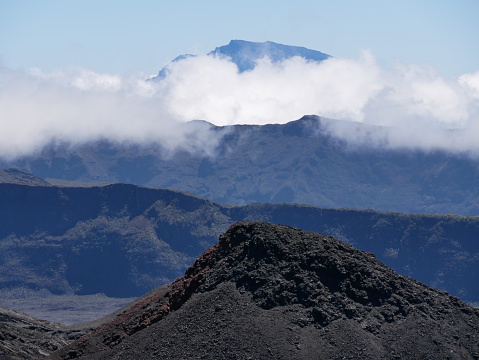 eruptive cone on the Fournaise volcano, Piton des neiges in the far background, Reunion island, france