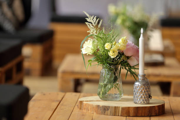 Flower decoration with a candle and empty space for text