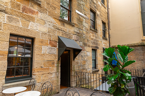 Sydney Rocks precinct on the shore of Sydney Harbour historical architecture from the first fleet settlement over 200 years ago. Buildings made from sandstone blocks small narrow streets NSW Australia