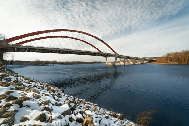 Winter scene of a bridge spanning the Mississippi River