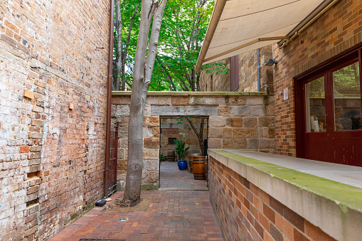 Sydney Rocks precinct on the shore of Sydney Harbour historical architecture from the first fleet settlement over 200 years ago. Buildings made from sandstone blocks small narrow streets NSW Australia