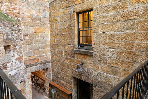 Sydney Rocks precinct on the shore of Sydney Harbour historical architecture from the first fleet settlement over 200 years ago. Buildings made from sandstone blocks small narrow streets NSW Australia