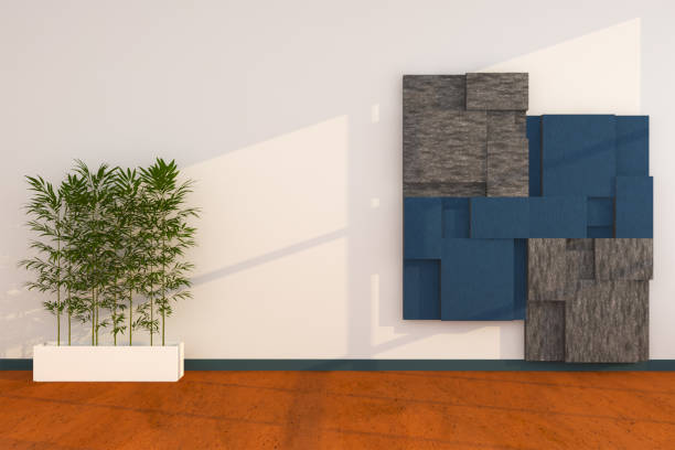Tropical plants on ornate wall background.
