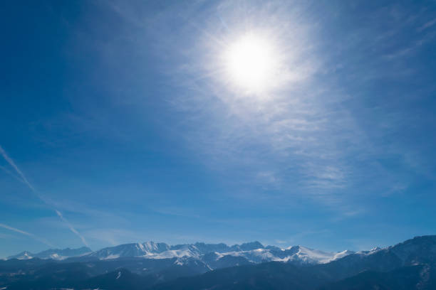 Snowy mountain peaks. Beautiful winter landscape in the mountains. Stone cliffs.